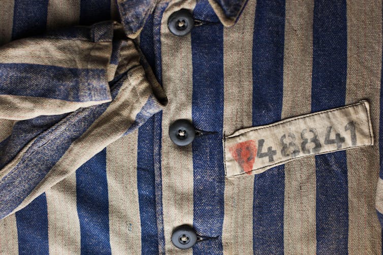 Concentration camp uniform worm by homosexuals with pink triangle