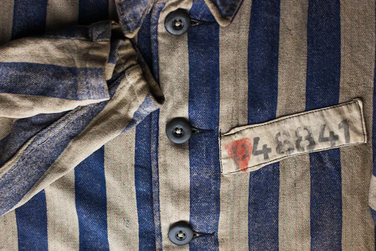 Concentration camp uniform worm by homosexuals with pink triangle
