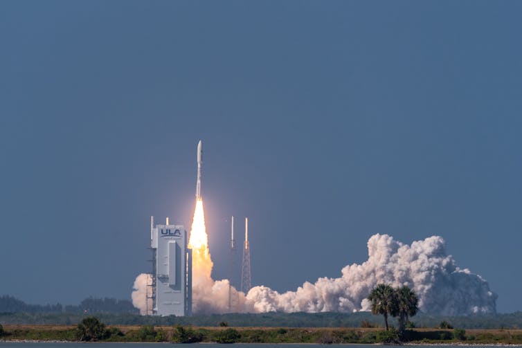 An Atlas-V rocket lifting off the launch pad.