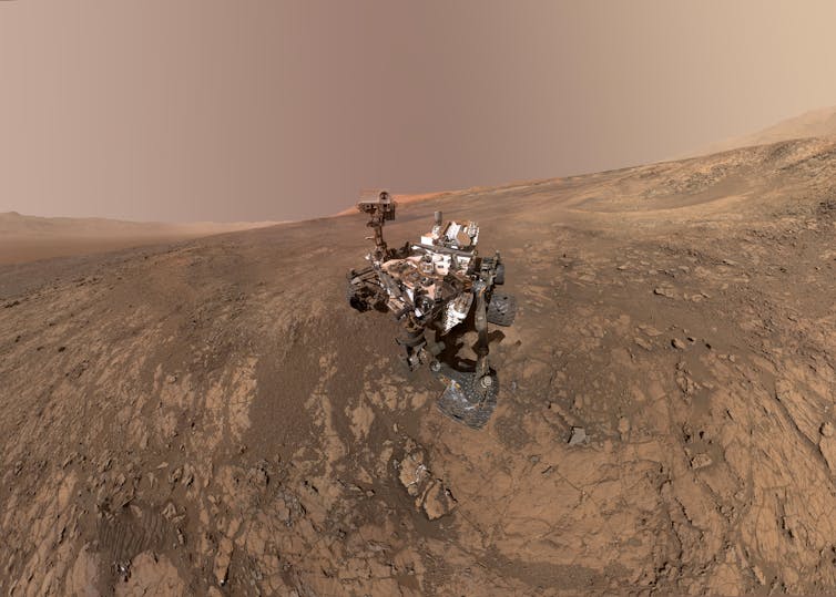 NASA's Curiosity Mars rover on Vera Rubin Ridge, with Mt Sharp in the background.