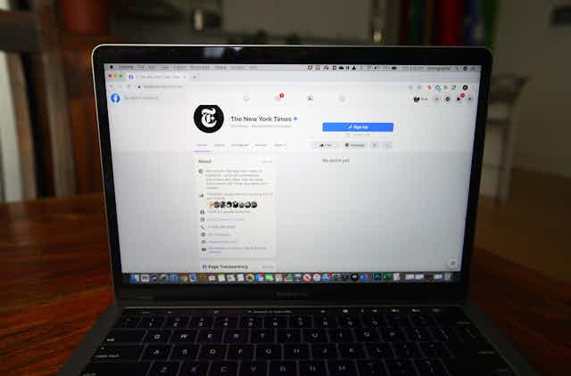 Computer screen with an empty New York Times Facebook page
