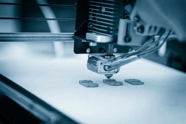 An electronic three dimensional plastic printer during work