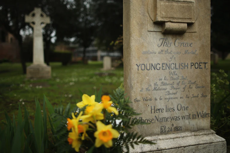 The stone reads that it marks the grave of a 'Young English Poet'
