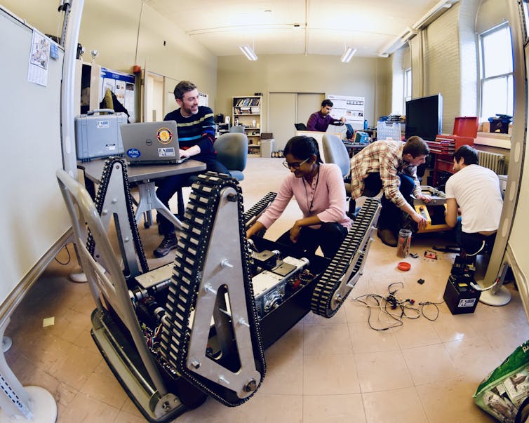 students in a robotics lab