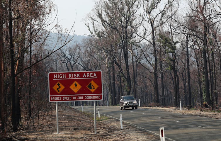 road sign warning of high fire risk in a burnt-out area