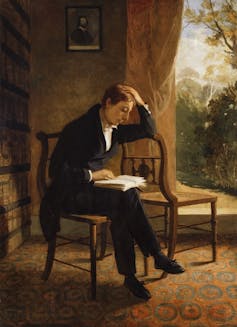 Painting of a young John Keats reading a book.