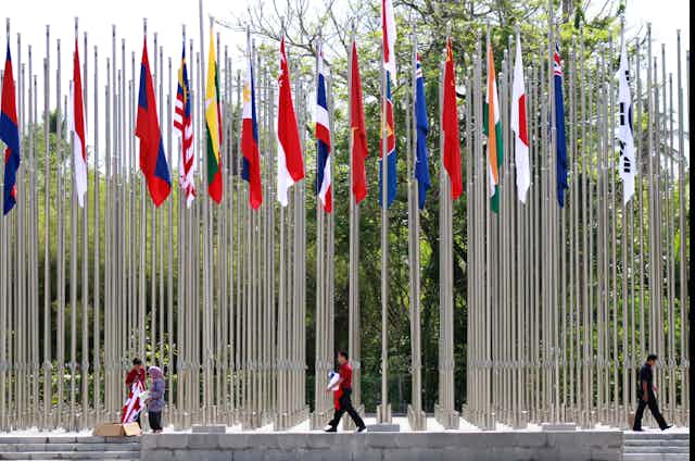 Staffs folding flags under dozens of flag masts.
