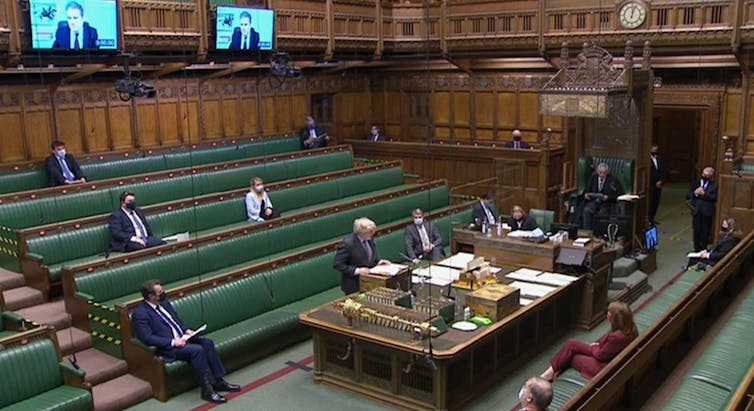 Boris Johnson speaking during Prime Minister's Questions as Keir Starmer dials in remotely.