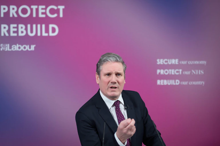 Labour leader Keir Starmer talks into a camera to deliver a speech on rebuilding the economy.