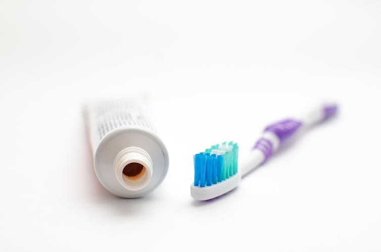 A tube of toothpaste and a toothbrush