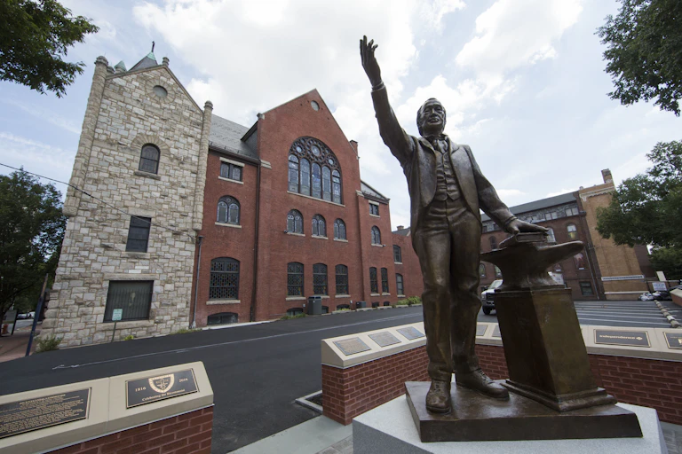 A sculpture depicting Bishop Richard Allen stands in front of Mother Bethel African Methodist Episcopal Church in Philadelphia.