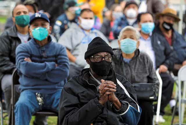 People wait for their turn to be vaccinated in Los Angeles