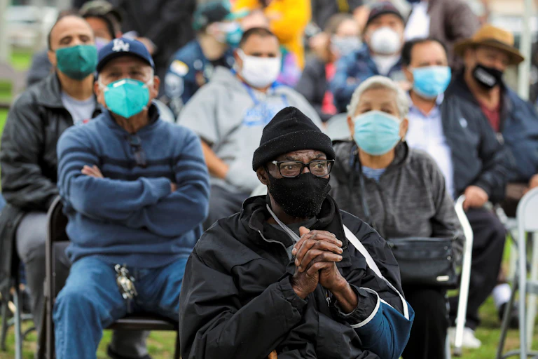 People wait for their turn to be vaccinated in Los Angeles