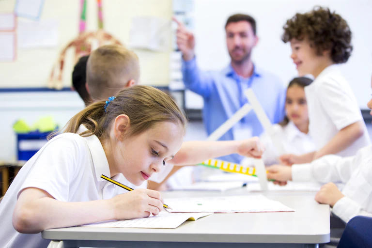 Young girl concentrating on her schoolwork.
