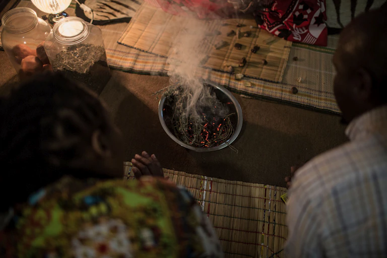 A client consulting a traditional healer