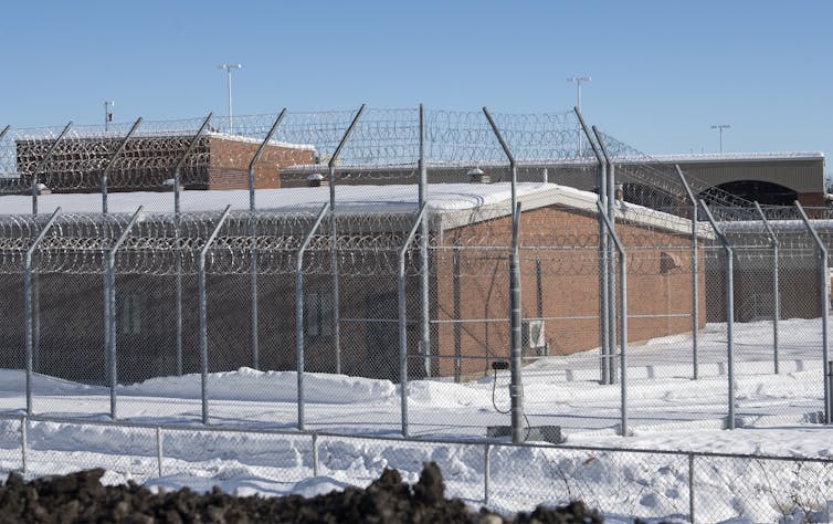 Saint-Jerome prison with barbed wire in front of the building