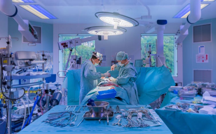 Supplies on tables in an operating room during surgery
