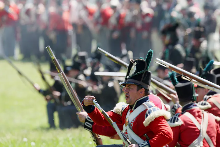 War of 1812 re-enactors stage a battle.