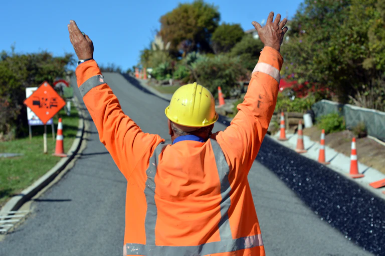 Road worker directing traffic