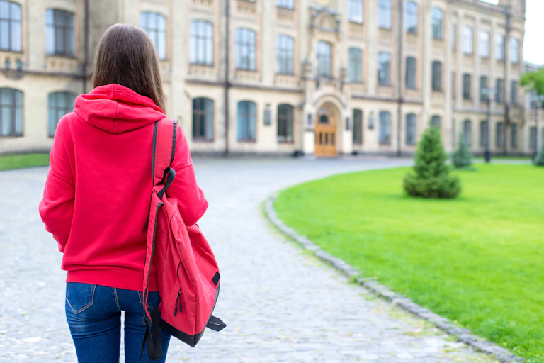 New student walks up to university buildings