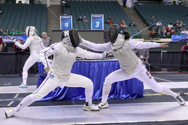 University fencers compete in a sports arena