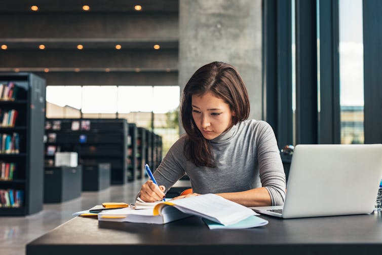 Young woman in university library