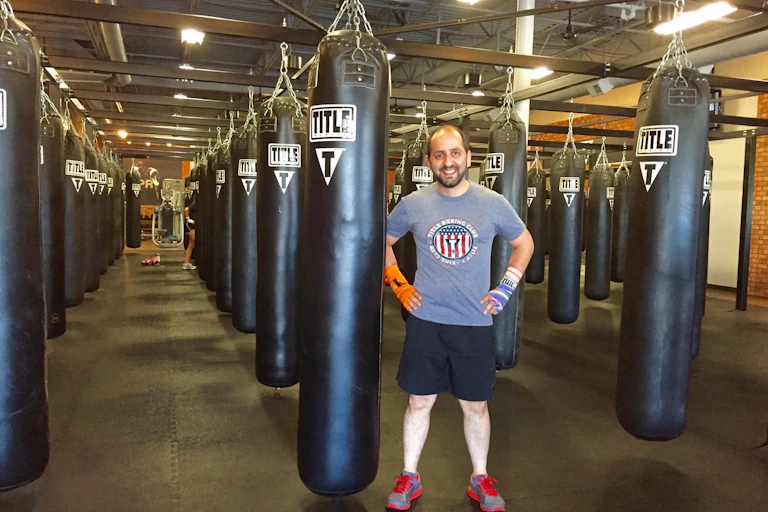 The author standing in front of punching bags.