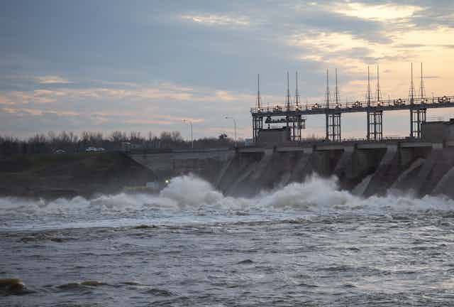 A hydroelectric dam with rushing water at the base