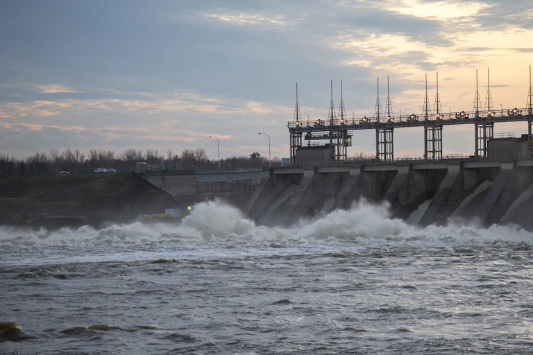 A hydroelectric dam with rushing water at the base
