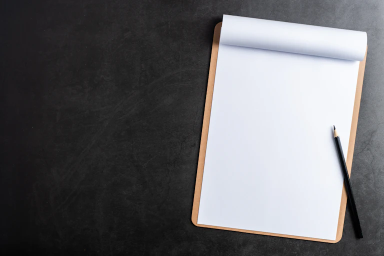 A blank clipboard with pencil.