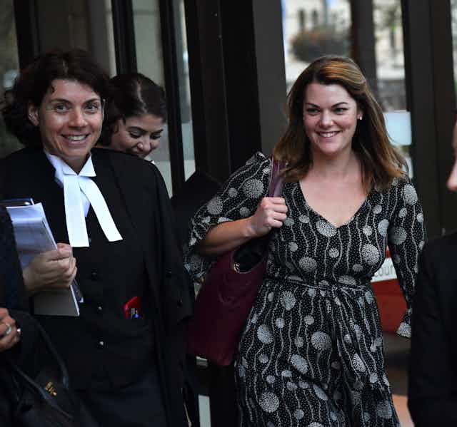 three women including lawyer and client leave court