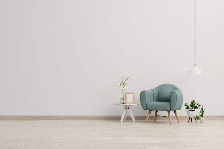 Chair and small table in empty room