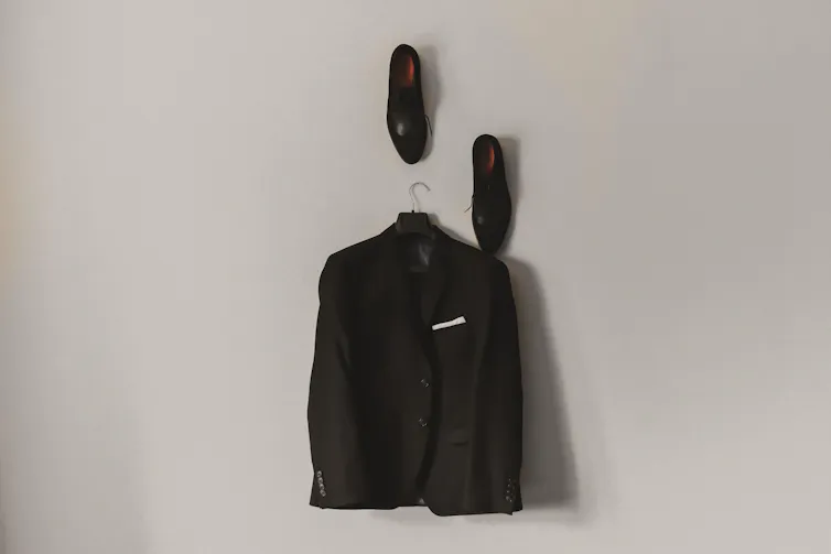 Suit and work shoes hanging up