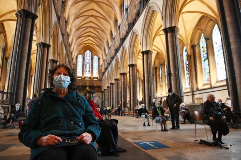 A woman waiting for a COVID-19 vaccination in Salisbury cathedral, UK