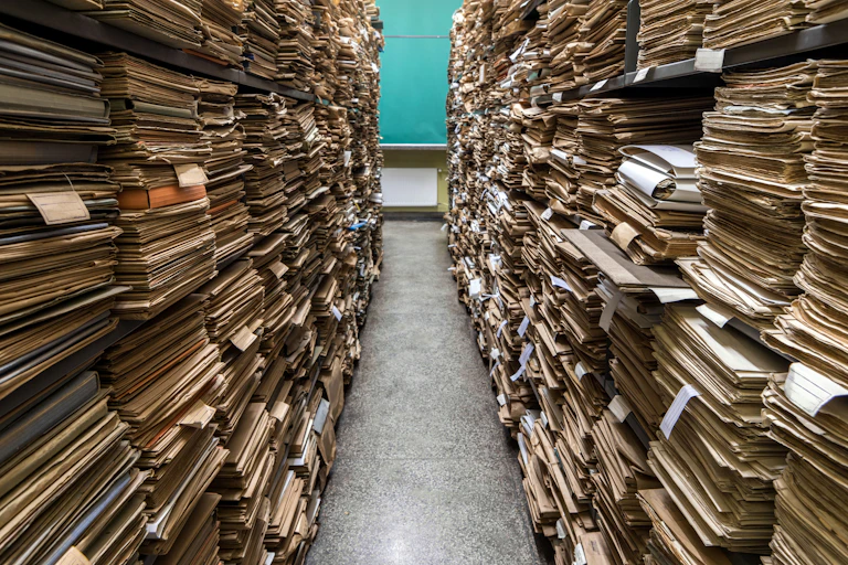 Two rows of piles of folders