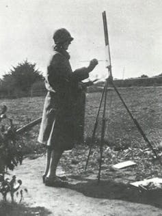 Old photo of woman outdoors