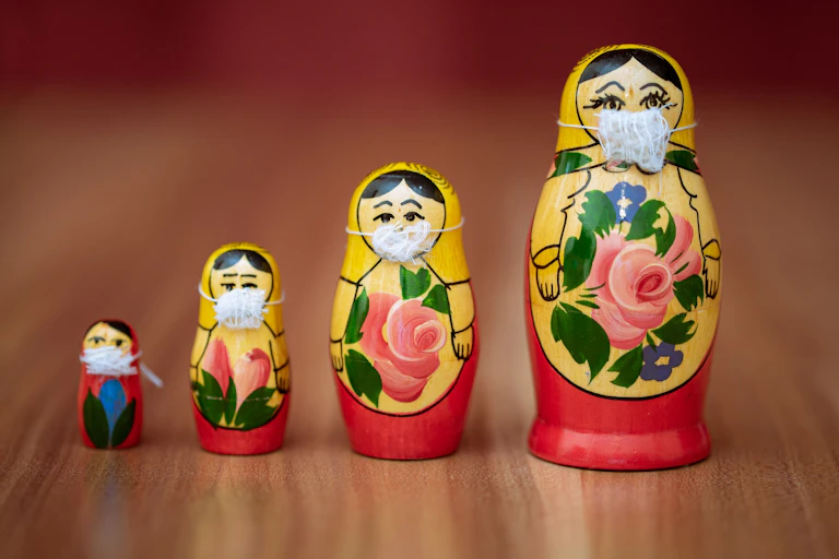 Russian dolls wearing face masks