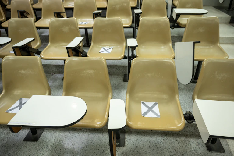 University chairs, some marked with x's.