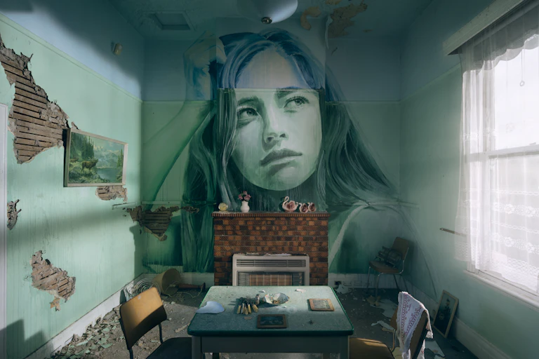 Painting of girl on wall of old room