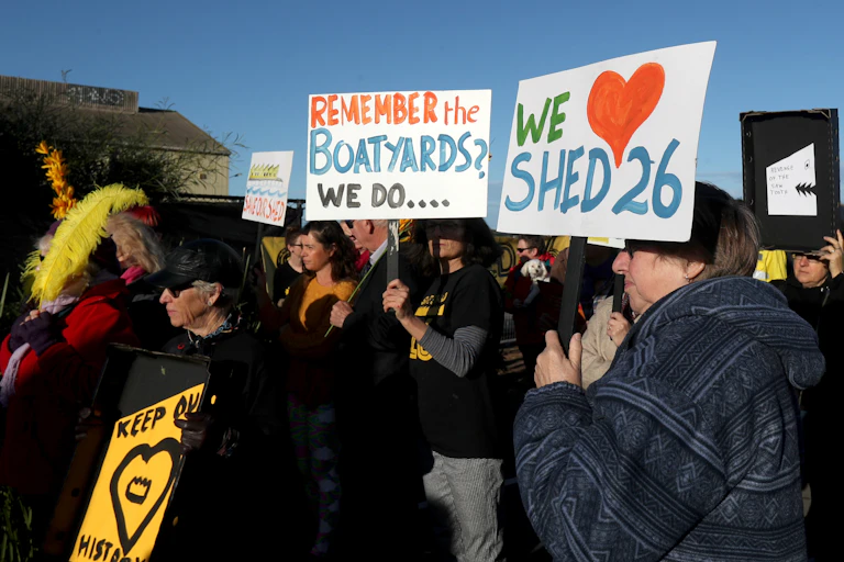 Protesters against the demolition of a waterfront shed