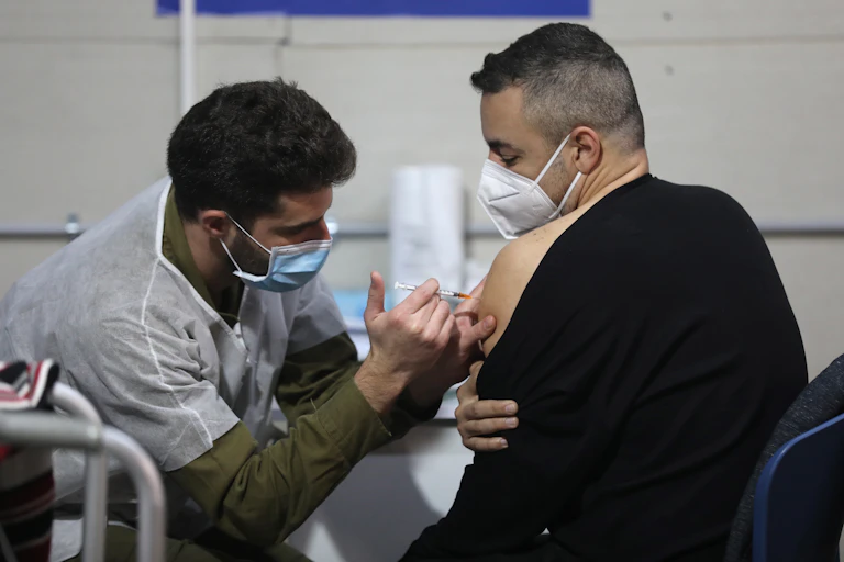 A man getting vaccinated for COVID-19 in Israel