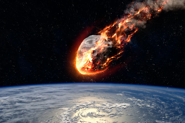 Drawing of an asteroid burning up as it approaches Earth, seen below.