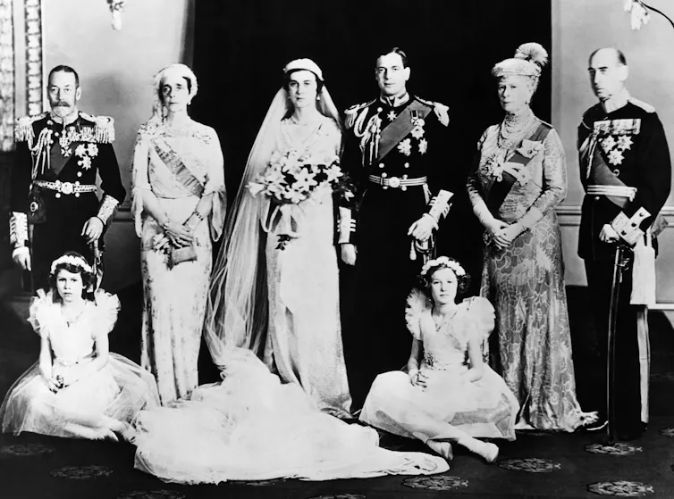 British Royal Family. Seated, from left: Future Queen of England Princess Elizabeth, Lady Mary Cambridge. Standing, from left: King George V of England, Grand Duchess Elena of Russia, Princess Marina, Duchess of Kent, Prince George, Duke of Kent, Queen Ma