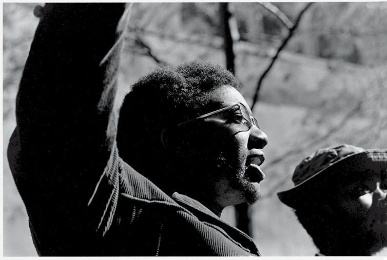 Black Panther Party leader Fred Hampton raises his arm