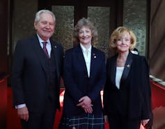 Sen. Patricia Duncan poses for a photograph with Sen. Raynell Andreychuk and Sen. Peter Harder outside the Senate Chamber.