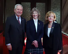 Sen. Patricia Duncan poses for a photograph with Sen. Raynell Andreychuk and Sen. Peter Harder outside the Senate Chamber.