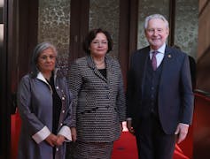 Sen. Rosemary Moodie (centre) poses for a photograph with Sen. Ratna Omidvar and Sen. Peter Harder outside the Senate Chamber.