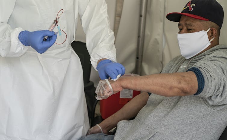 A man getting a blood test for COVID-19.