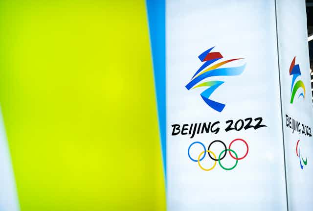 The logo for the Beijing 2022 Olympics is displayed at a venue