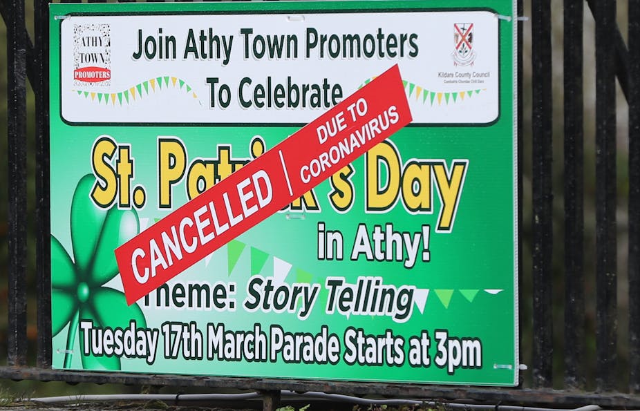 A St. Patrick's day banner with a cancelled sign over it.